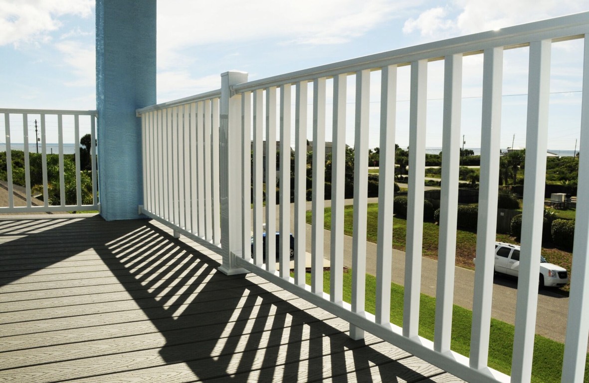 White painted deck railings with vertical pickets on elevated deck in Hawthorne